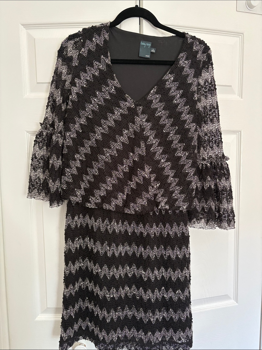 Gabby Skye Black and Silver Zigzag Lace Long Sleeve Dress